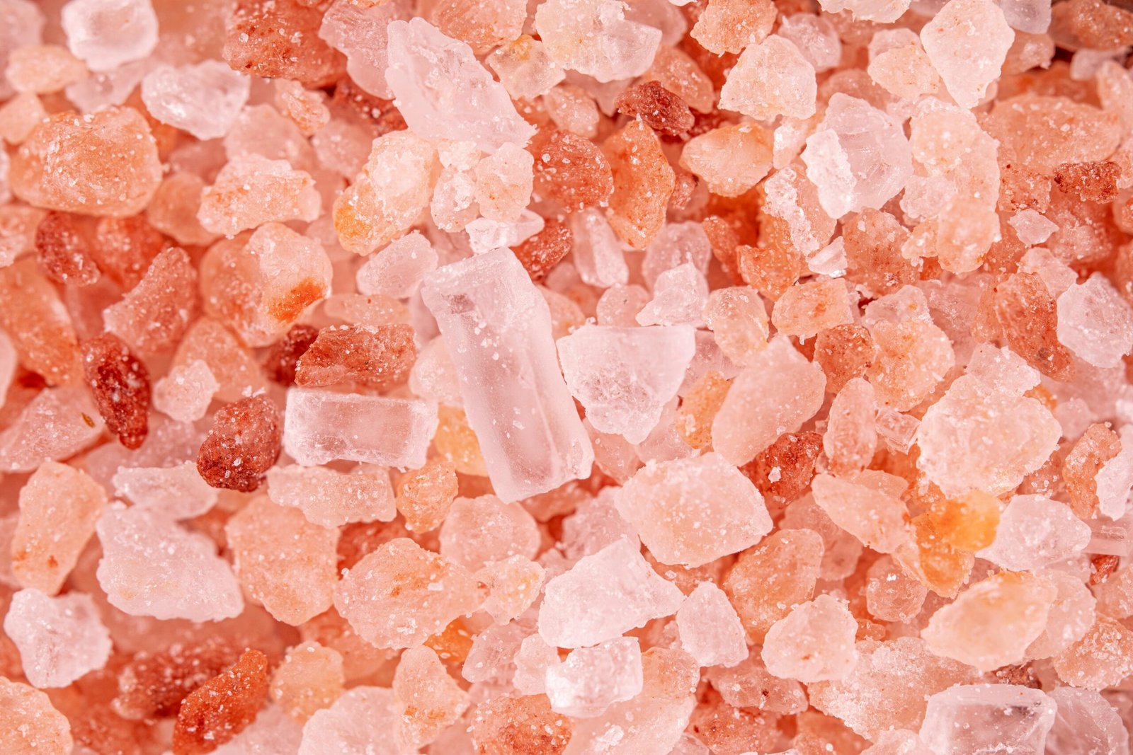 about us & our services Macro image showcasing the detailed texture and color of pink Himalayan salt crystals.